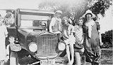 Aunt Gertrude, Raymond, Genevieve, bare foot and sitting on car fender,  Margaret Ross, Helen, Mary and Melvin, circa 1926.
